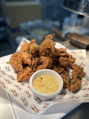 Jus Strips - seasoned crispy chicken tenders tossed in our special jerk spiced flour blend and fried to perfection.