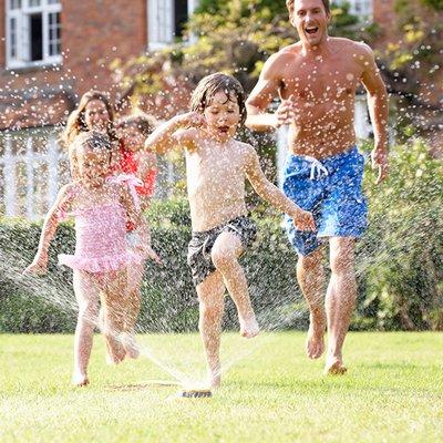 Family Playing in New Yard