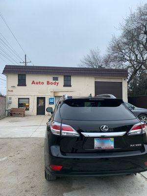 My car with repaired bumper outside the shop