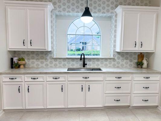 Refresh your kitchen with new additions.
We painted cabinets, installed new countertops, sink faucet, backsplash, pendant light and handles