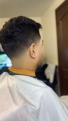 Curly hair with low skid drop fade