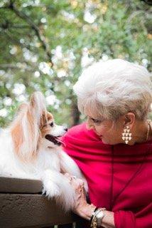 My service dog, Robinhood, & I share a moment on the balcony off my office.