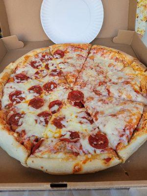 Half cheese half pepperoni pizza.