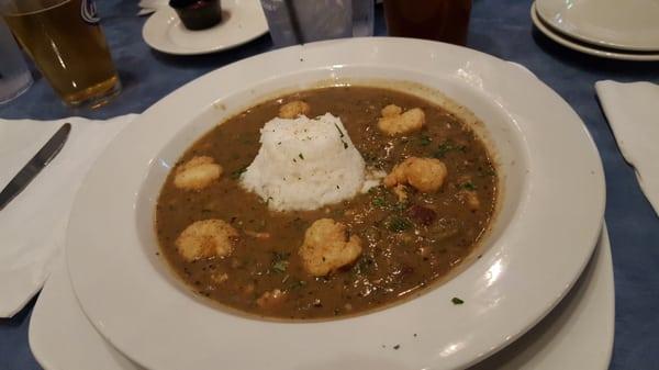 Bowl of gumbo (chicken and andouille) with crispy shrimp and rice. Aggressively spiced!