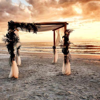 4 post bamboo canopy with blush garlands and palms