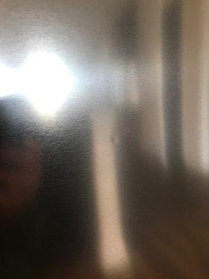 Dent on refrigerator door