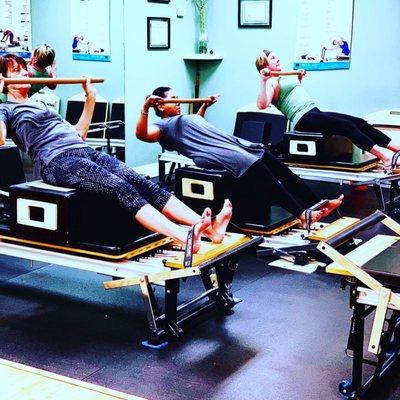 Working core using Pilates short box on the Reformer.