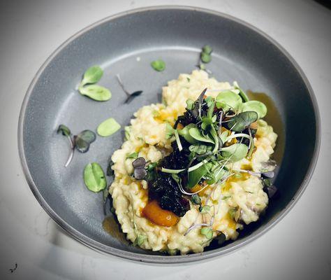 Vegan risotto with local Swiss chard and heirloom tomatoes.