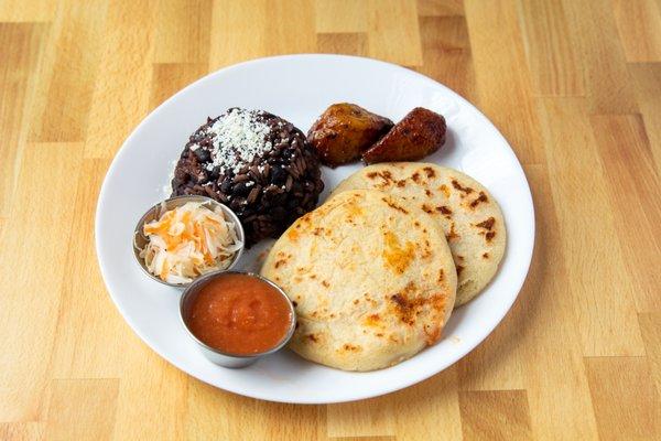 a Two Pupusa Plate serve with Casamiento (rice & beans), sweet plantains, roasted red tomatoes salsa, Curtido (pickle cabbage)