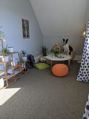 Our meditation space at Ancora Wellness with  coloring pages, a library, and sand tray.