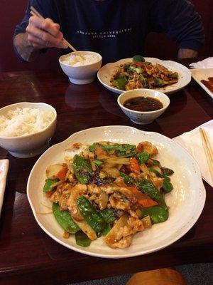 Chicken and snow peas with garlic sauce; garlic chicken in the back