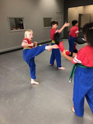 Round kick target practice in After School Karate