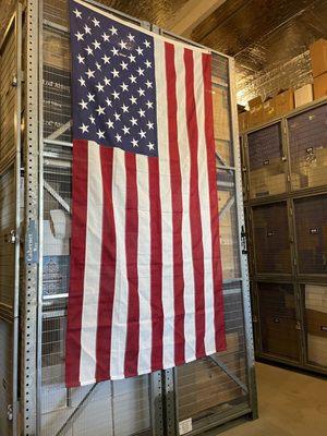 Large flag draping down lockers