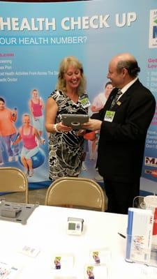 Dr. Corey Rodnick at a Health Fair giving a posture analysis