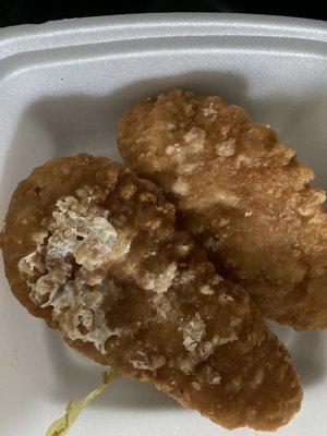 Weird white stuff (not damp breading) on the bottom of my son's chicken fingers.