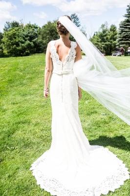 Lace bridal gown (back shot) and veil with lace trim