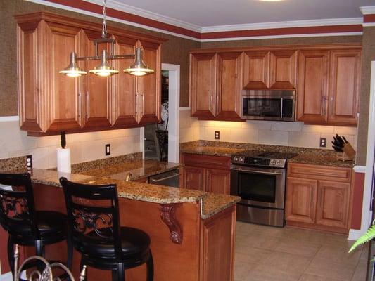 Maple kitchen with raised panel doors