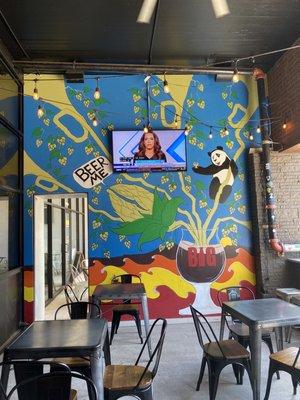 Outdoor seating & super cool funky mural