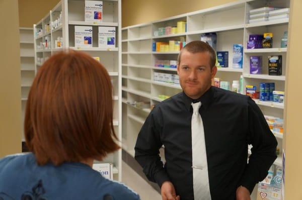 Owner and pharmacist, Shane, counseling a patient