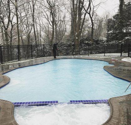 Making sure this beautiful pool doesn't stain from stagnant water - even in winter!