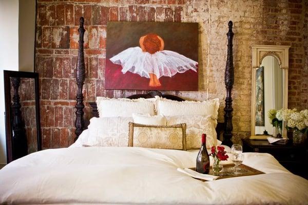 The artwork above the bed and the mirror to the right on the nightstand is an original by Susan Bishop.