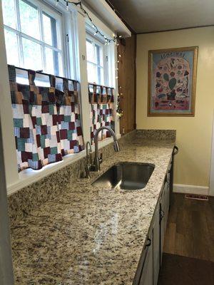 New countertops and backsplash  Trim and outlets fixed by handyman Jimmy Falardeau.