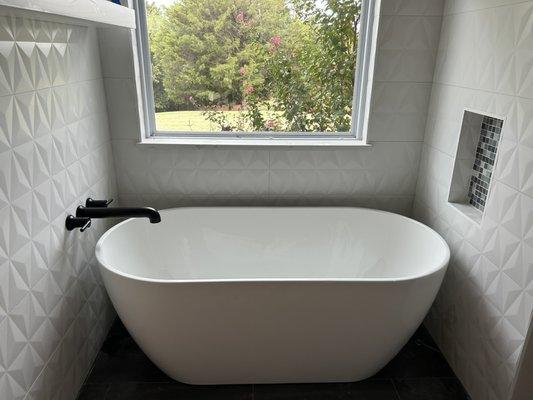 After removing the previous corner tub we were able to install this beautiful freestanding tub along with a wall mount faucet.