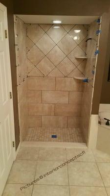 Walnut tile on the shower wall. job done by Interior Concepts.