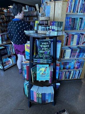 Book Buyer Shae adjusting displays