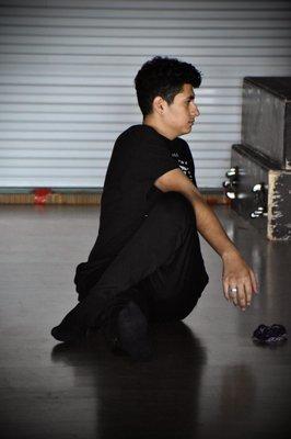 Stretching before dance class at Arizona Folklorico Dance Studio in Tucson, AZ