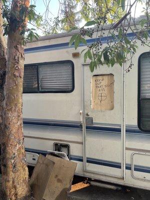 Broken window on a trailer that has been parked outside the property for 6 months.