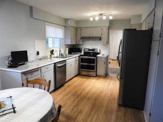 Opened up kitchen. Cabinet paint. New countertops. New appliances.