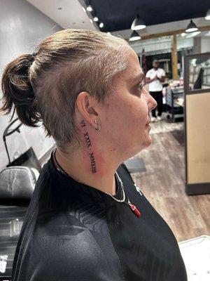 Small neck tattoo