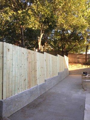 Concrete retaining wall. Driveway extension. New fence