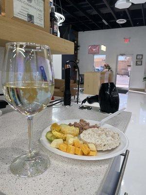 Complimentary Wine and snacks while you wait!