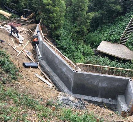 Lower retaining wall for slide repairs - one of 4 retaining walls for slide repairs. Recaptured over 3000 square feet of usable land