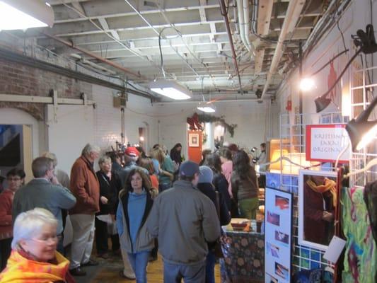 A crowded hallway during Open Studios weekend