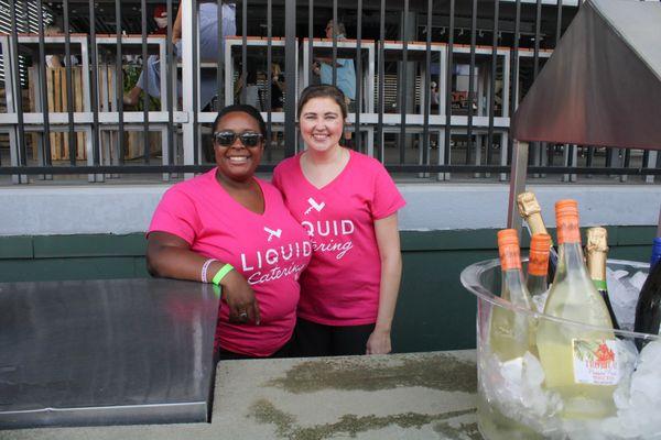 Two Liquid Catering bartenders smile for the camera at Euphoria