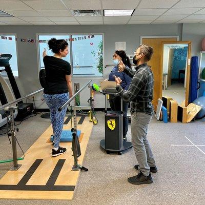 Max working with a patient on some balance exercises.