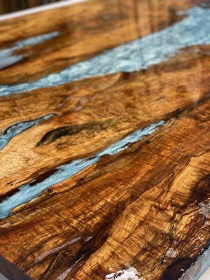 Maplewood, with unique aqua blue epoxy resin  dining table