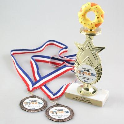 Large selection of trophies and stock medals at Global Recognition. Optional custom trophy and custom full color personalization is shown.