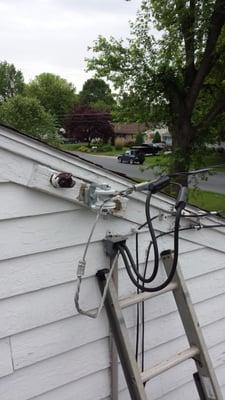 Was rubbing against the house and old screw-in insulator was failing. Extended away from house and bolt-thru clevis installed.