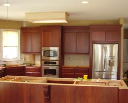 Cherry Euro style kitchen with crotch mahogany island