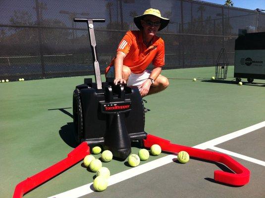 Tennis Pro Leif Nordlund collecting balls