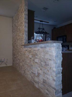 Veneer stacked stone on wall