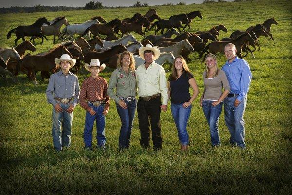 Family portrait on horse ranch.