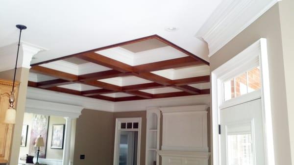 Faux wood beams on a coffered ceiling