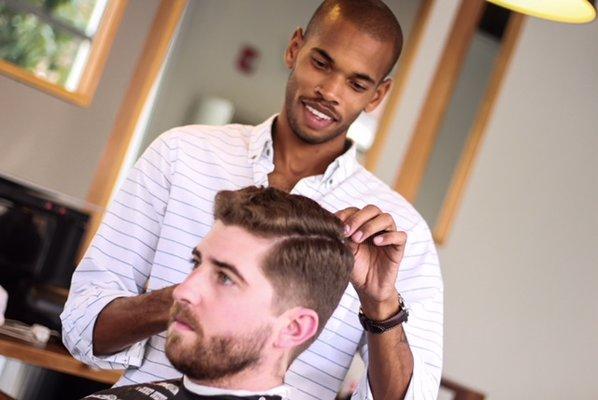 Founder and head barber Shaun working with a client