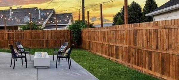 Fencing installation, drainage, grading, retaining wall, sod and rock