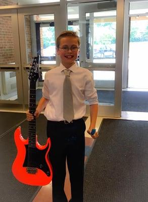 One of the winners of our guitar giveaway